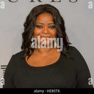 Actress Octavia Spencer walks the red carpet during the global celebration event for the film Hidden Figures at the SVA Theatre December 10, 2016 in New York City, New York. The film is based on the true story of the African-American women who worked as human computers during the Friendship 7 mission in 1962. Stock Photo
