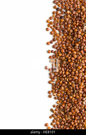 Red quinoa seeds isolated on white background. Stock Photo