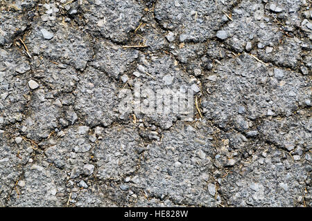 Cracks in old asphalt pavement close up Stock Photo