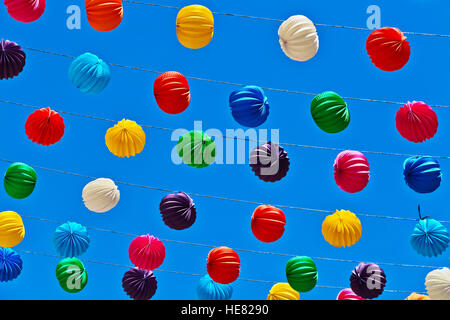 Paper Lanterns on blue sky background at the celebration in Ronda, Malaga (Andalusia), Spain. Stock Photo