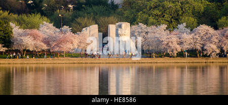 Panoramic view of the Martin Luther King, Jr., Memorial, with blossoming cherry trees along the Tidal Basin in Washington, DC. Stock Photo