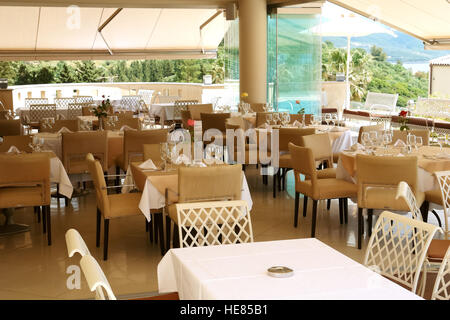 Sivota, GREECE, May 09, 2013: Stylish restaurant with views of the Ionian Sea in Greece. Stock Photo