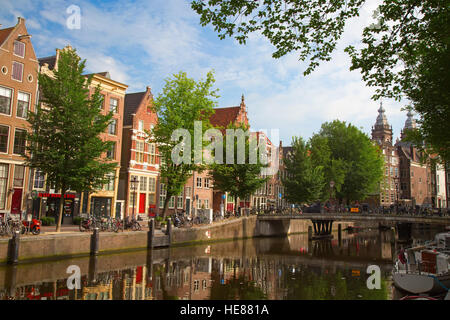 AMSTERDAM - JULY 10: Canals of the Amsterdam city on July 10, 2016 in Amsterdam, Netherlands. The historical canals of the city surrounded by traditio Stock Photo