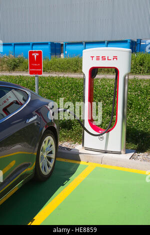 ZURICH - July 30:  Tesla Supercharger station on July 30, 2016 in Zurich, Switzerland. Tesla motors develops network of the charging stations across E Stock Photo