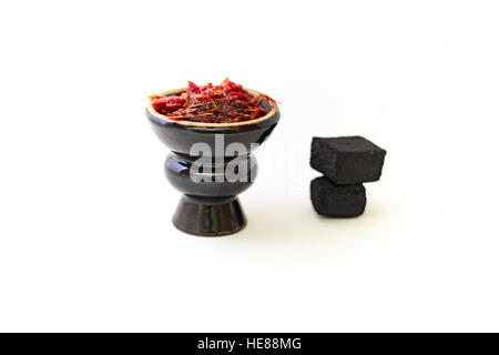 Hookah head with tobacco inside and coals on the pure white background. Stock Photo