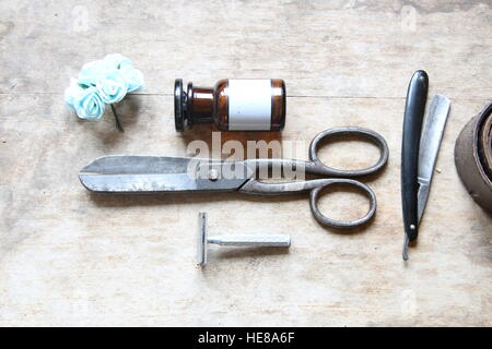 Vintage barber shop equipment on wood background Stock Photo