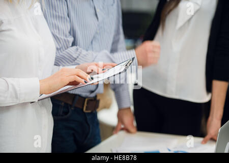 Business people meeting to discuss the situation on the market Stock Photo
