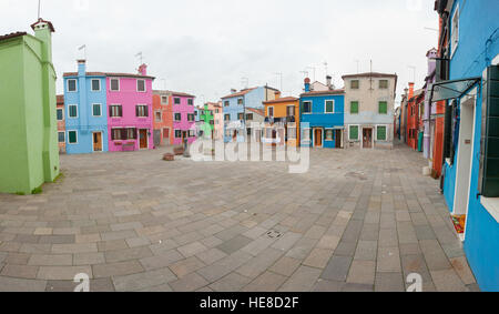 VENICE, ITALY - FEBRUARY 09, 2016: view on colorful houses from a secondary street in Burano island during a cloudy winter day Stock Photo