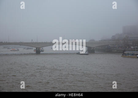 London, UK. 17th December, 2016. Waterloo Bridge seen from the Golden Jubilee Bridges on a foggy day. Stock Photo