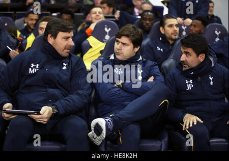 Tottenham Hotspur manager Mauricio Pochettino (centre), assistant Jesus Perez (right) and first team coach Miguel D'Agostino during the Premier League match at White Hart Lane, London. PRESS ASSOCIATION Photo. Picture date: Sunday December 18, 2016. See PA story SOCCER Tottenham. Photo credit should read: Nick Potts/PA Wire. RESTRICTIONS: EDITORIAL USE ONLY No use with unauthorised audio, video, data, fixture lists, club/league logos or 'live' services. Online in-match use limited to 75 images, no video emulation. No use in betting, games or single club/league/player publications. Stock Photo