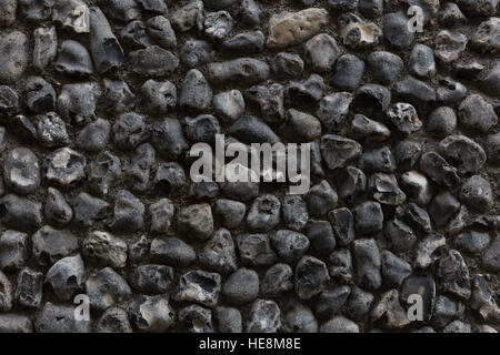 Close-up of building with textured, coarse grey, black and white pebbledash exterior wall treatment Stock Photo