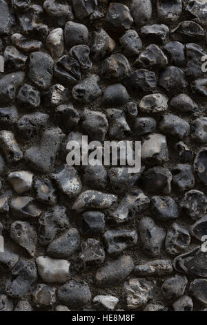 Close-up of building with textured, coarse,grey, black and white pebbledash exterior wall treatment Stock Photo