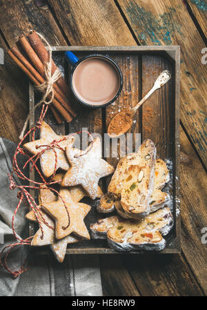Cocoa in mug with Christmas gingerbread cookies, pieces of Stollen Stock Photo
