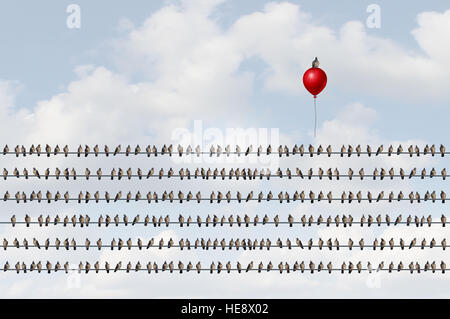 Concept to think different as a group of birds on a wire with an upward moving bird on a red balloon as a business success metaphor of oputsider think Stock Photo