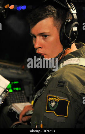 Nevada Air National Guard Capt. Daniel Shure, C-130 pilot from the 192nd Airlift Squadron, prepares for takeoff from St. John's Newfoundland, on May 24, 2014, in support of Allied Forge 2014.  This exercise, led by the U.S. Army 82nd Airborne Division in conjunction with the 152nd and 165th Air National Guard Airlift Wings, is the first-ever interoperability exercise designed to enhance bilateral capabilities between the United States and the French 2nd Foreign Parachute Regiment.  Tech. Sgt. Erica J. Knight Stock Photo