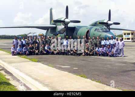 US Marine Corps (USMC) personnel from Marine Aerial Refueler/Transport Squadron 152 (VMGR-152); 3rd Air Delivery Platoon; and 3rd Force Service Support Group pose for a photograph with Bangladesh Defense Force Air Wing personnel, in front of a Antonov AN-32P aircraft at Chittagong AB, Bangladesh, during Exercise BENGAL TIGER 2002. The Exercise is a bilateral training exercise between United States Marine Corps Aviators and Members of the Bangladesh Defense Force Air Wing. Stock Photo