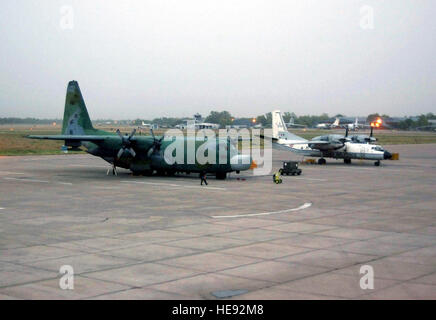 A US Air Force (USAF) MC-130H Combat Talon II aircraft assigned to the 1st Special Operations Squadron, 353rd Special Operations Group (SOG), is parked on the flight pad at Air Force Station Agra, India. An Indian Air Force AN-32 Cline aircraft is parked to it’s right. Stock Photo