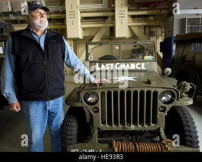 Paul Williams stands with his 1945 Willys MB jeep July 26, 2014, during JBER's Arctic Thunder Open House. The MB is a replica of the jeep driven by Williams' father, Army Cpl. Francis Williams, during the Battle of the Bulge. The Arctic Thunder Open House features more than 40 Air Force, Army and civilian aerial acts, July 25-27, and has an expected crowd of more than 200,000 people. It is the largest two-day event in the state and one of the premier aerial demonstrations in the world. The 2014 Arctic Thunder Open House is a proud part of the Anchorage Centennial Celebration. David Bedard)