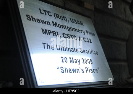 Kabul, Afghanistan -- A plaque in honor of retired Army Lt. Col. Shawn Pine sits ready outside a building on Camp Eggers May 20, 2010. In ceremonies at Camp Eggers and Sia Sang, buildings were dedicated to Shawn Pine and Air Force 1st Lt. Roslyn Schulte, two Combined Security Transition Command-Afghanistan members who were killed by an IED one year ago.  Air Force Staff Sgt. Rachel Martinez/released) Stock Photo