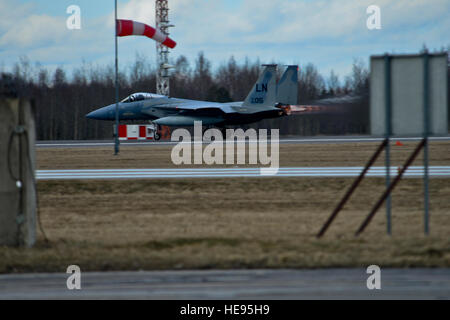 A U.S. Air Force F-15C Eagle aircraft assigned to the 493rd Expeditionary Fighter Squadron takes off from ?iauliai, Lithuania, March 19, 2014, during Baltic Air Policing. The U.S. Air Force assumed command of the NATO Baltic Air Policing mission for a four-month rotation from January to May of 2014.  Airman 1st Class Dana J. Butler Stock Photo