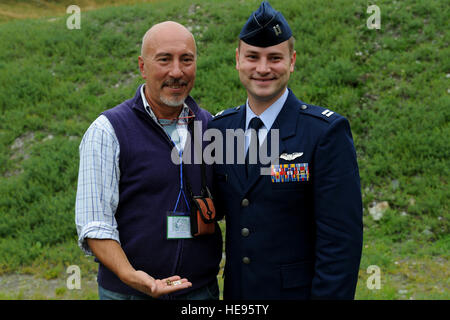 Capt. Sean Burke presents Gianni Boschis with his U.S. insignias at the French Commemoration Ceremony for the B-17 of the Aguille des Glaciers, September 4, Bourg Saint Maurice, France.  Colonel Sonkiss, commander, 15 Airlift Squadron and 12 others from Joint Base Charleston participated in two commemoration ceremonies for the crew of B-17 #43-39338 in Courmayeur, Italy and Bourg Saint Maurice on September 3rd and 4th.   The B-17 crew was from the 15th Troop Carrier Squadron which is now the 15th AS.  Dignitaries and family members of the crew were in attendance. The entire eight man crew was  Stock Photo