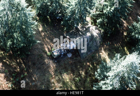 Aerial view of a transporter-erector-launcher (TEL) vehicle covered with camouflage netting, during ground launch cruise missile (GLCM) evaluation. Stock Photo