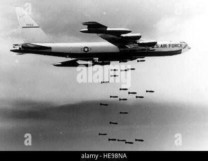 Boeing B-52F-70-BW (S/N 57-0162) in flight dropping bombs. (U.S. Air Force photo) Stock Photo