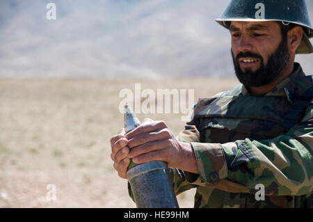 100616-F-1020B-009 Kabul - An Afghan National Army soldier prepares to launch an 88MM mortar round at the Kabul Military Training Center June 16, 2010. The three-week heavy weapons course is part of a series of Advanced Combat Training offered to ANA soldiers after completing basic training.  Staff Sgt. Sarah Brown/) Stock Photo