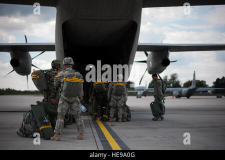Bulgarian and U.S. Soldiers board a Bulgarian Air Force C-27J Spartan aircraft during Steadfast Javelin II at Ramstein Air Base, Germany, Sept. 2, 2014. Steadfast Javelin II is a NATO-led exercise designed to prepare U.S., NATO and international partner forces for unified land operations.  Senior Airman Damon Kasberg Stock Photo