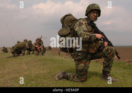 Conducting a combined ground assault at a drop zone near Bezmer Air Base, Bulgaria, Bulgarian paratrooper 2nd Lieutenant Rumen Lozanov from the 1st Special Forces Battalion is followed by fellow soldiers and U.S. Air Force Airmen from the 86th Contingency Response Group during Exercise Thracian Spring 2008, an annual bilateral training exercise between the United States and Bulgarian Armed Forces.  The 86th CRG Airmen are deployed from Sembach Air Base, Germany with Bulgarian soldiers from the 68th Special Forces Brigade.  Master Sgt. Scott Wagers / (released) Stock Photo