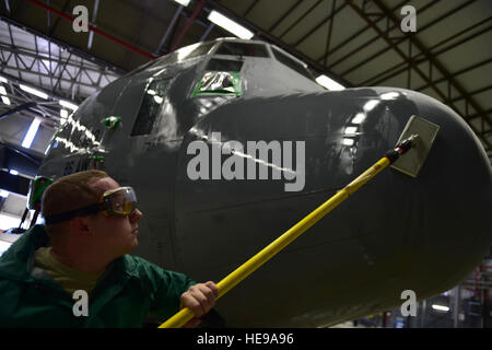 Staff Sgt. Nathan Baker, 86th Aircraft Maintenance Squadron aircraft hydraulics craftsman, washes the nose of a C-130J Super Hercules April 20, 2015, at Ramstein Air Base, Germany. All C-130Js at Ramstein are washed regularly for corrosion prevention and control. Keeping major structural components clean helps improve the life span of aircraft, thus keeping them operational longer. Staff Sgt. Sara Keller) Stock Photo