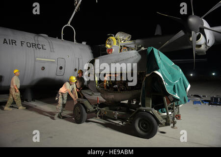 Airmen from the 379th Expeditionary Aircraft Maintenance Squadron perform a C-130 engine swap at the 379th Air Expeditionary Wing in Southwest Asia, completing the operation in 12 hours to return the aircraft to service on schedule. Stock Photo