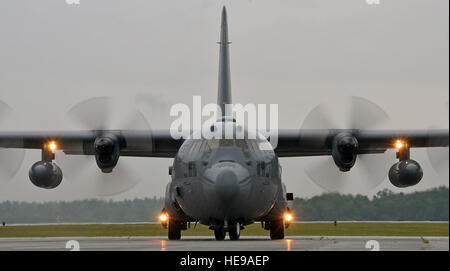 A C-130 Hercules taxis on the flightline July 14, 2014, at Westover Air Reserve Base, Mass. The C-130 crew picked up 12 Airmen assigned to the 439th Aeromedical Evacuation Squadron. AE units provide tactical aeromedical evacuation for injured U.S. troops and regional unified commands. Flight nurses and medical technicians have the capability to fly patients on more than five different aircraft, which include the C-17 Globemaster III, KC-135 Stratotanker, C-21, C-130, and the KC-10 Extender. Staff Sgt. Kelly Goonan) Stock Photo