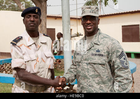 Djiboutian Sgt. Maj. Adole Hamadov, Camp Cheik Osman's newest liaison officer to Camp Lemonnier, Djibouti, poses with U.S. Air Force Chief Master Sgt. James Davis, Combined Joint Task Force - Horn of Africa command senior enlisted leader, after being introduced here, March 7. This meet and greet was held to introduce Hamadov to Davis. Hamadov is scheduled to take command April 1. Stock Photo