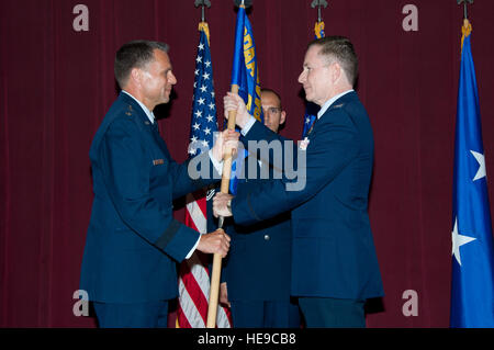 Maxwell AFB, Ala. - Spaatz Center Commander Maj Gen Scott Hanson presents the guidon of the International Officer School to Col Douglas M. Schauber during the IOS change of command at Air War College's Brocks Auditorium on June 8, 2012.   ( Melanie Rodgers Cox Stock Photo