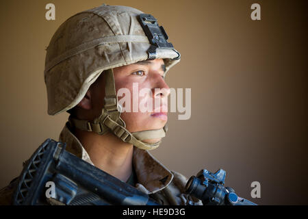 U.S. Marine Lance Cpl. C.L. Paez, rifleman, 2nd Battalion, 7th Marine Regiment, stands guard during an urban clear exercise as part of Integrated Training Exercise 2-16 at Marine Corps Air Ground Combat Center, Twentynine Palms, Calif., Feb. 11, 2016.  MCAGCC conducts relevant live-fire combined arms, urban operations, and joint/coalition level integration training that promote operational forces' readiness.  Senior Airman Steven A. Ortiz Stock Photo