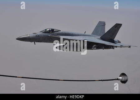 A U.S. Navy F/A-18F Super Hornet approaches a Royal Australian Air Force KC-30A drogue line to refuel during a combat sortie over Iraq July 2, 2015. The RAAF KC-30A operates as part of the Australian Air Task Group. The sortie was part of Combined Joint Task Force-Operation Inherent Resolve, a multinational effort to weaken and destroy Islamic State in the Levant operations in Iraq and Syria. Tech. Sgt. Christopher Boitz) Stock Photo