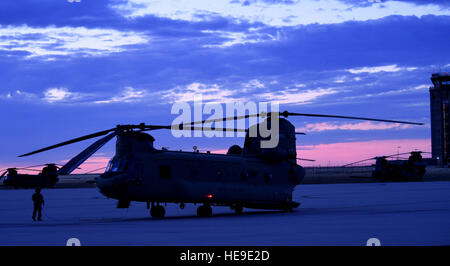 A CH-47 Chinook helicopter sits as the air crew prepares for takeoff to Denver International Airport August 17, 2016, on Buckley Air Force Base, Colo. The air crew and helicopter took part in the annual National Disaster Medical System training exercise, which included transporting patients to and from Denver hospitals.  Airman 1st Class Gabrielle Spradling Stock Photo