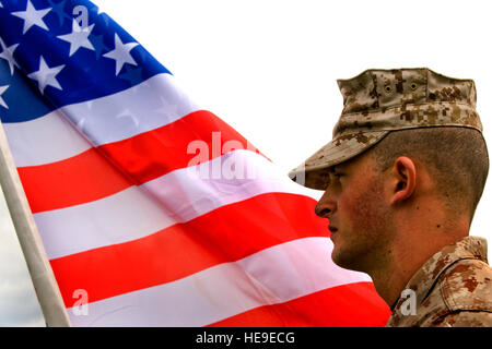 U.S. Marine Corps Sgt. Ryan Halcovich, 6th Communications Battalion, Brooklyn, N.Y., holds the American flag during opening quarters of exercise Combined Endeavor 2010 on Sept. 2, 2010, in Grafenwoehr, Germany. Combined Endeavor 2010 is the world's largest communications interoperability exercise, preparing international forces' command, control, communications and computer systems for multinational operations. (U.S. Air Force Photo/Airman 1st Class Samuel W. Goodman) Stock Photo