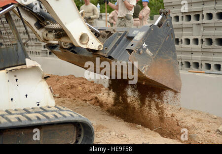 U.S. Marine Lance Corporal Rikki Dominey, a heavy equipment operator with a 271st Marine Wing Support Squadron, 2nd Marine Air Wing, out of Marine Corps Air Station Cherry Point, N.C.,  moves dirt using a Bobcat T190 dirt mover at Gabriela Mistral primary school in Ocotes Alto, Honduras, June 3, 2015. The school project is one part of the New Horizons Honduras 2015 training exercise, an annual humanitarian and event organized by U.S. Southern Command. New Horizons was launched in the 1980s and is an annual joint humanitarian assistance exercise that U.S. Southern Command conducts with a partne Stock Photo