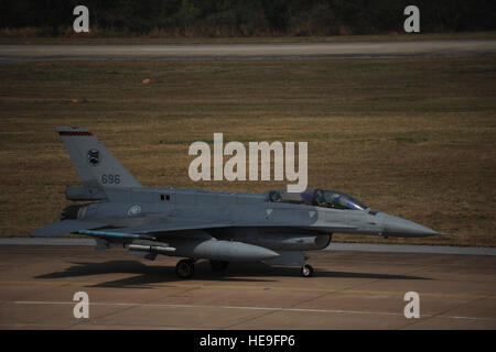 An F-16 Eagle prepares for flight operations during Cope Tiger 13 at Korat Royal Thai Air Force Base, Thailand, March 12, 2013.  More than 400 U.S. service members are participating in CT13, which offers an unparalleled opportunity to conduct a wide spectrum of large force employment air operations and strengthen military-to-military ties with two key partner nations, Thailand and Singapore. 2nd Lt. Jake Bailey) Stock Photo