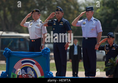 From right to left, Gen. Herbert J. Carlisle, commander of Pacific Air Forces, Commander in Chief of the Royal Thai Air Force Air Chief Marshal Prajin Juntong and Singapore's Chief of Air Force (Designate) Brig. Gen. Hoo Cher Mou, salute during the closing ceremony for Cope Tiger 13 at Korat Royal Thai Air Force Base, Thailand, March 22, 2013. More than 300 U.S. service members are participating in CT13, which offers an unparalleled opportunity to conduct a wide spectrum of large force employment air operations and strengthen military-to-military ties with two key partner nations, Thailand and Stock Photo