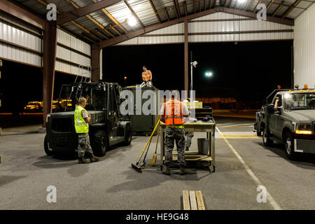 U.S. Air Force Airmen with the 437th Aerial Port Squadron tie down pallets of cargo during Crescent Reach 15 here May 19, 2015. This local exercise, which lasted May 18-21, 2015, tested and evaluated Joint Base Charleston's ability to launch a large aircraft formation in addition to process and deploy duty passengers and cargo in response to a simulated crisis abroad. Deploying members' ability to survive and operate in deployed environments was also exercise through Chemical, Biological, Radiological, Nuclear Explosives training and evaluation events.  Senior Airman Nicholas Byers) Stock Photo