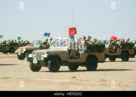 Crews of an Egyptian ranger battalion parade in Jeep light vehicles in a demonstration for visiting dignitaries during Operation Desert Shield. Stock Photo