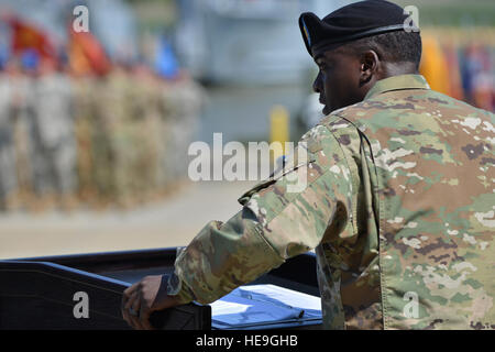 U.S. Army Command Sgt. Maj. Quillar L Ransom Jr., command sergeant major of the 7th Transportation Brigade, speaks to members of the brigade before officially taking responsibility at Fort Eustis, Va., May 26, 2016. Ransom’s previous position was as the command sergeant major of the 302nd Brigade Support Battalion, 1st Armored Brigade Combat Team, 2nd Infantry Division in Camp Casey, Korea. (U. S. Air Force  Staff Sgt. Natasha Stannard) Stock Photo