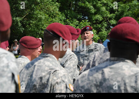 U.S. Army Maj. Gen. John Nicholson Jr., Commanding General, 82nd Airborne Division, speaks to paratroopers during a ceremony at the Iron Mike paratrooper memorial near the Normandy village of Sainte-Mère-Église, France, June 8, 2014. Nearly 1,000 paratroopers participated in the mass airdrop as part of the 70th anniversary commemoration of the D-Day landing in Normandy, France.  Erica J. Knight. Stock Photo