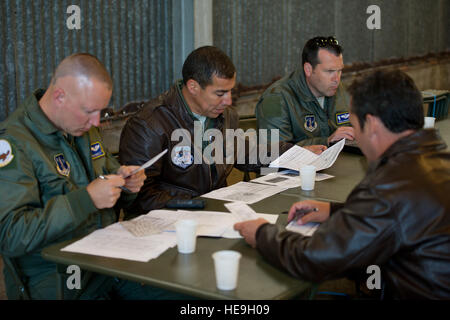 Nevada Air National Guard Lt. Col. Ceasar Garduno, commander of the 192nd Airlift Squadron, Reno, conducts a mission briefing prior to flying an airdrop mission near the Normandy village of Saint-Mère-Eglise, France, June 8, 2014. Over 1,000  paratroopers participated in the mass air drop as part of the 70th anniversary commemoration of the D-Day landing in Normandy, France.  Master Sgt. Donald R. Allen Stock Photo