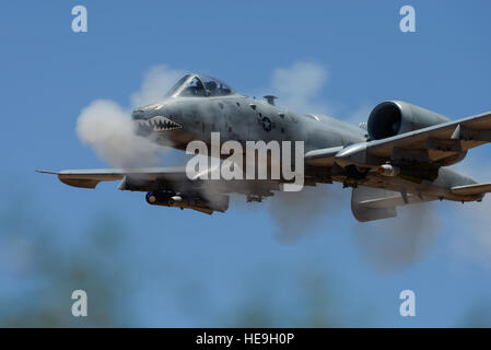 An A-10C Thunderbolt II assigned to 75th Fighter Squadron performs a low-angle strafe during the 2016 Hawgsmoke competition at Barry M. Goldwater Range, Ariz., June 2, 2016. Hawgsmoke took place over the course of two days and included team and individual scoring of strafing, high-altitude dive-bombing, Maverick missile precision and team tactics.  Senior Airman Chris Drzazgowski Stock Photo