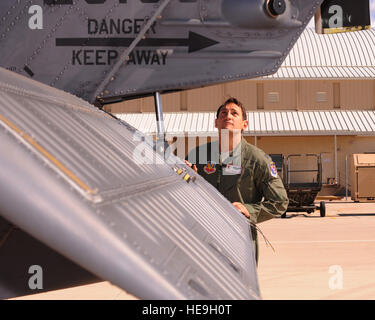 Capt. Brian R. Dicks, 55th Rescue Squadron pilot, performs a pre-flight inspection on an HH-60G Pave Hawk helicopter at Davis-Monthan AFB, Ariz., Nov. 4, 2013. Dicks was chosen to receive the Air Rescue Association's 2013 Richard T. Knight Award for his leadership and bravery during his latest deployment to Afghanistan. ( Airman 1st Class Chris Massey Stock Photo