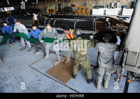 power plant c-130j Air Predator a missile load airmen US onto a Force MQ 1